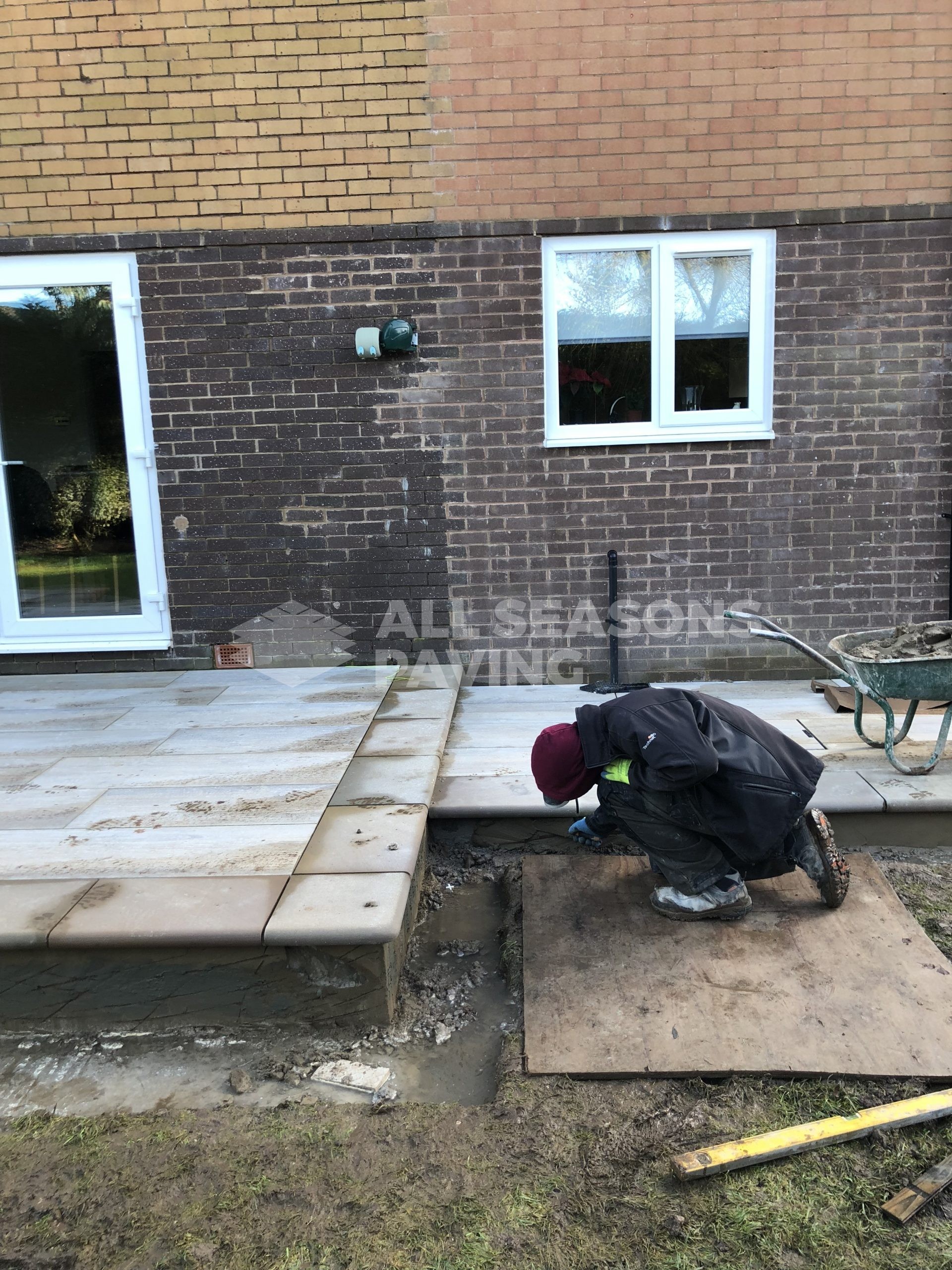 porcelain patio teak wood effect in leyland near preston workers completing the process