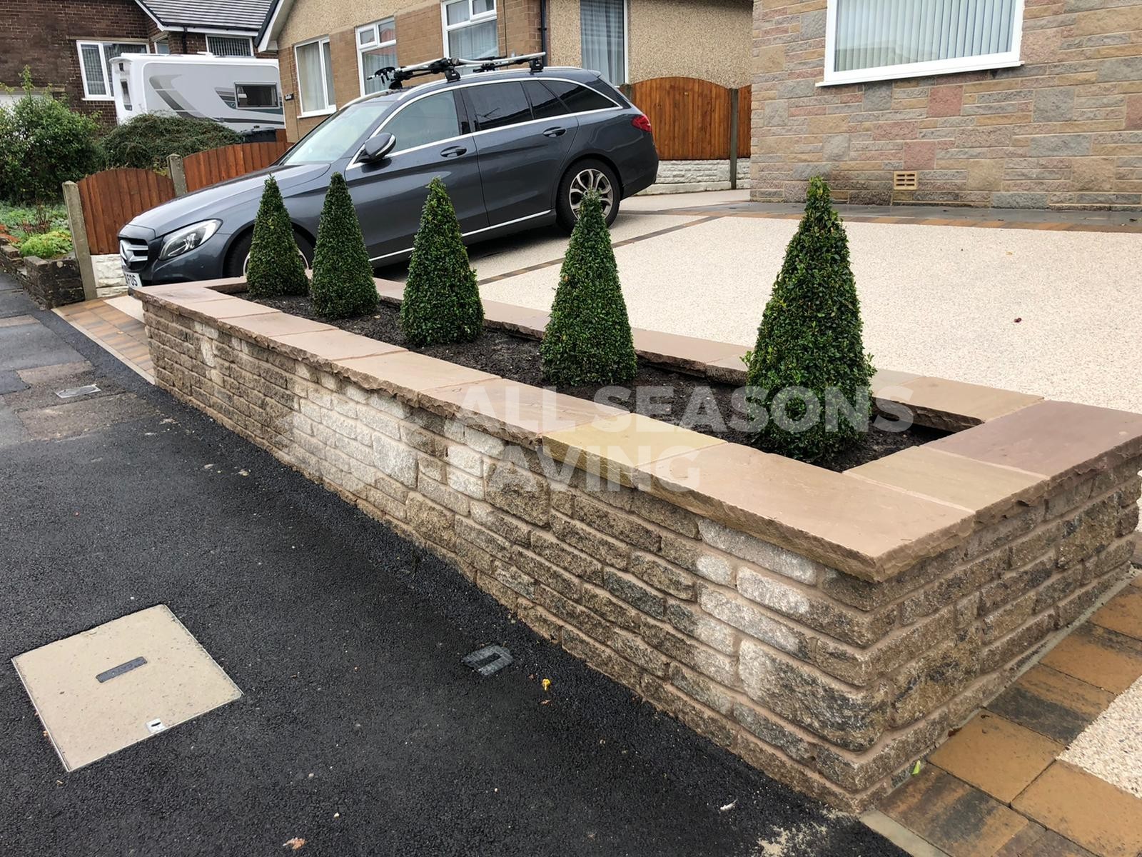 Resin bound driveway pearl quarts view of car and plants in Preston, Lancashire