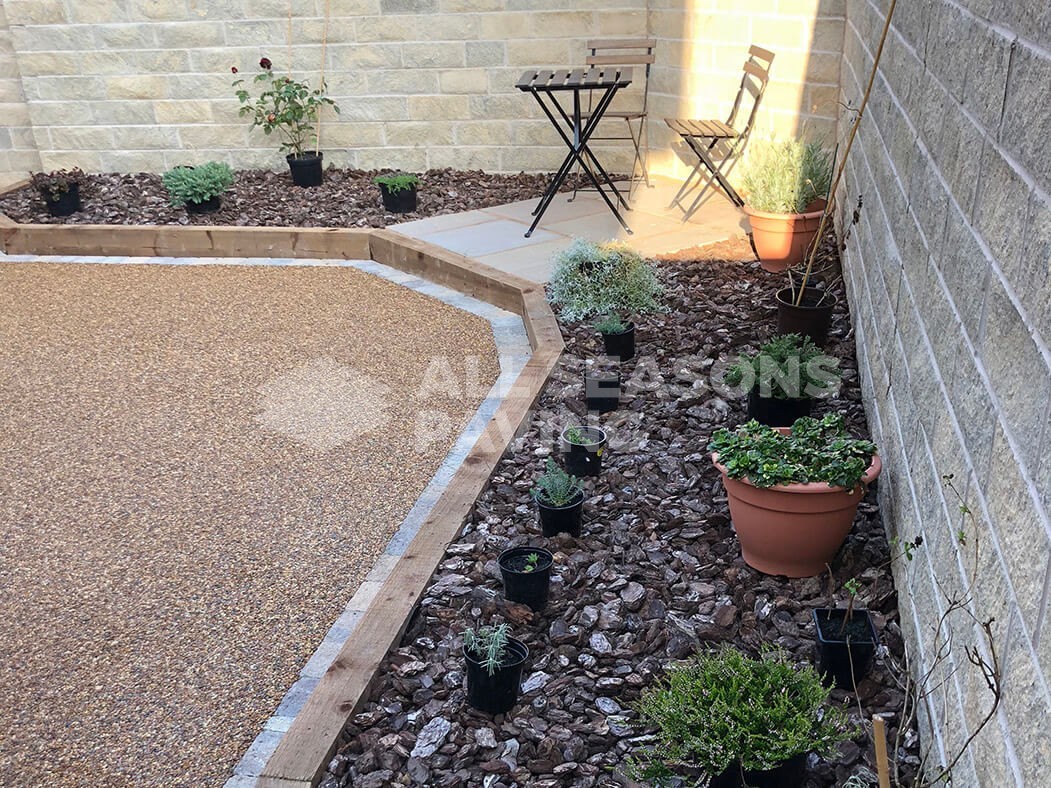 View of resin patio near Preston in Lancashire showing landscaped seating area.