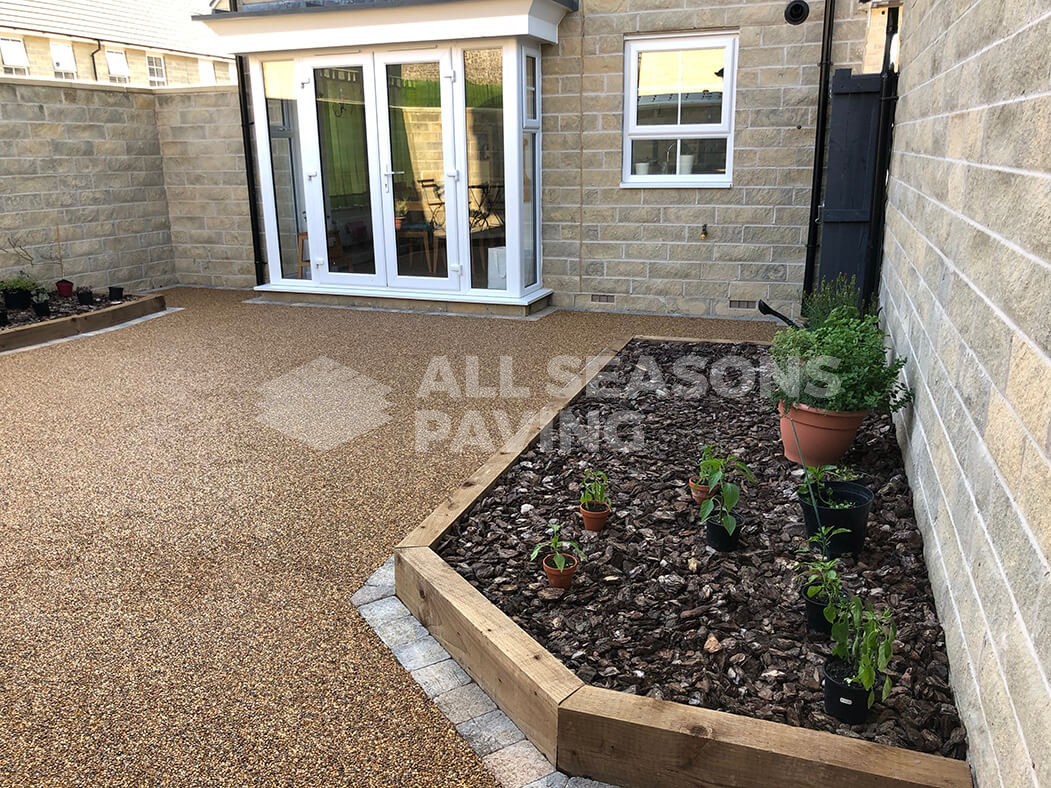Resin Bound patio installed in Lancashire, near Preston showing raised flower bed.