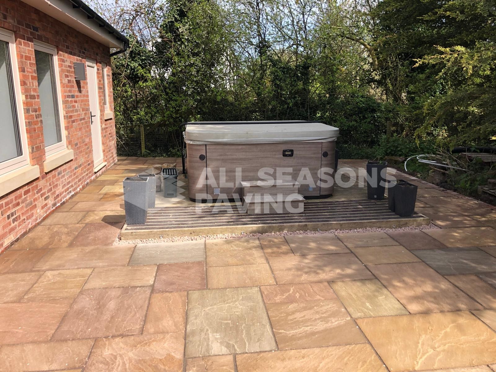 indian stone installed around hot tub