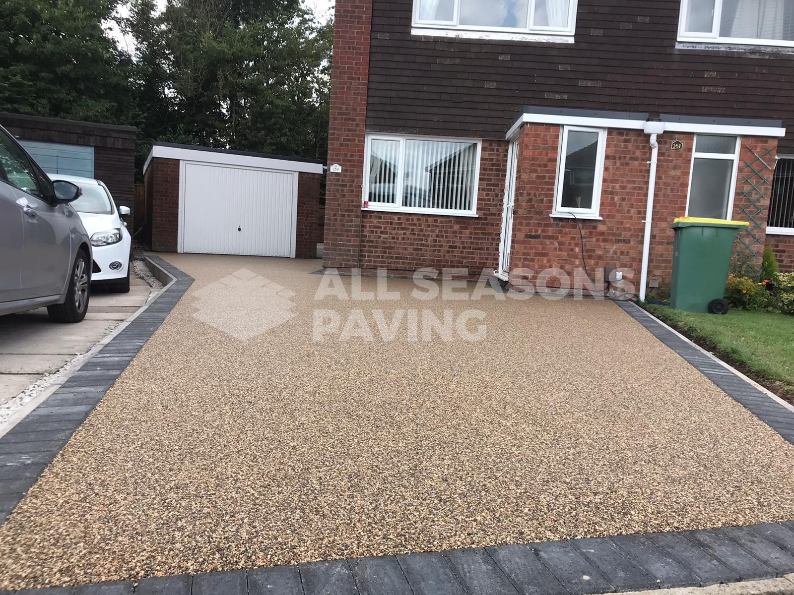 A previously installed Resin driveway in Ingol Preston using our Cappuccino resin bound aggregate with charcoal tobermore block border