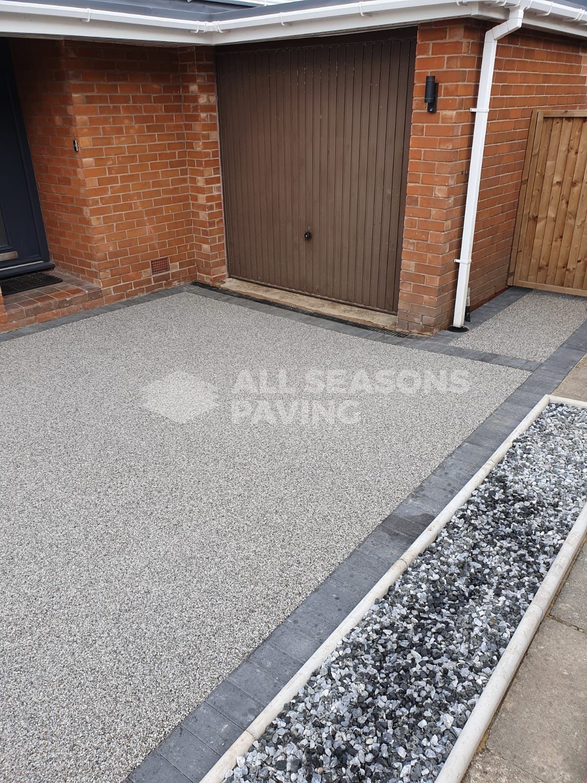Mercury resin driveway installed in Chorley charcoal block border new fence and new front lawn