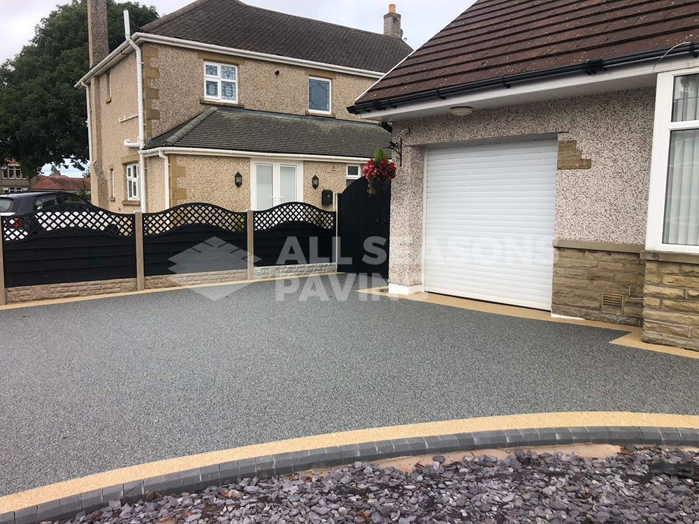 Starlight resin bound driveway installed in Morecambe Lancashire with borders and step
