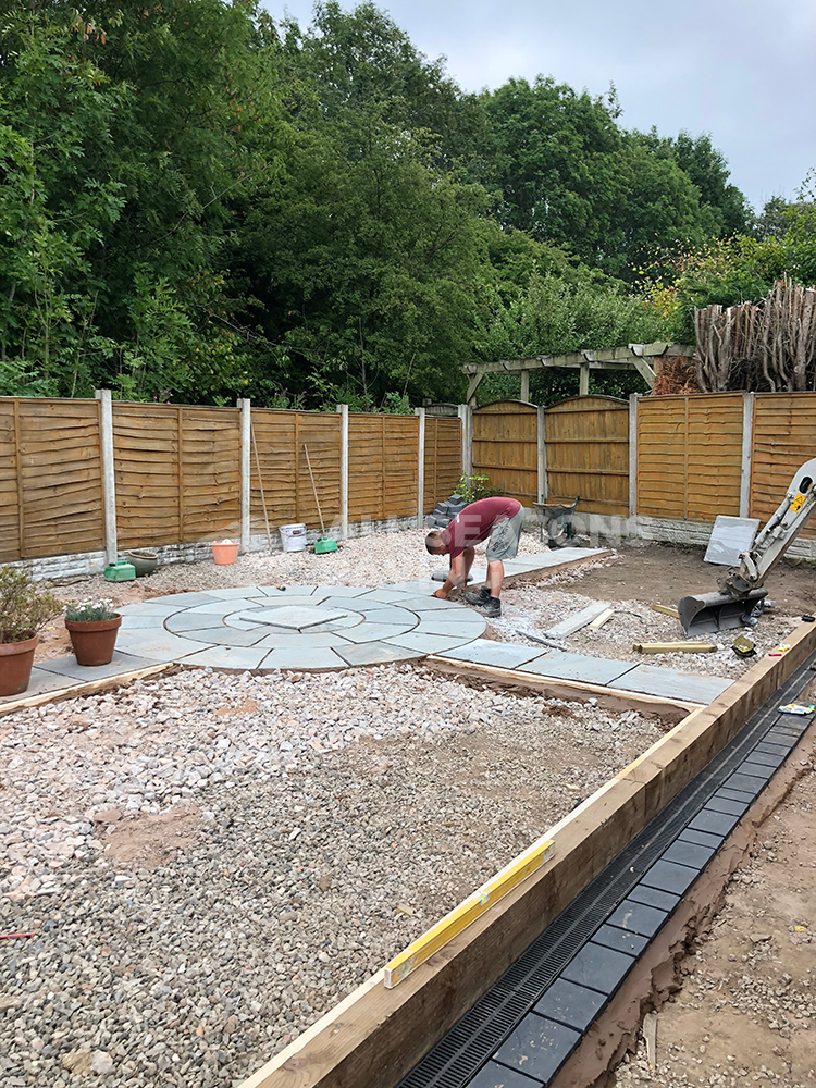 Workers completing full resin bound driveway and landscaping project in Preston, Lancashire