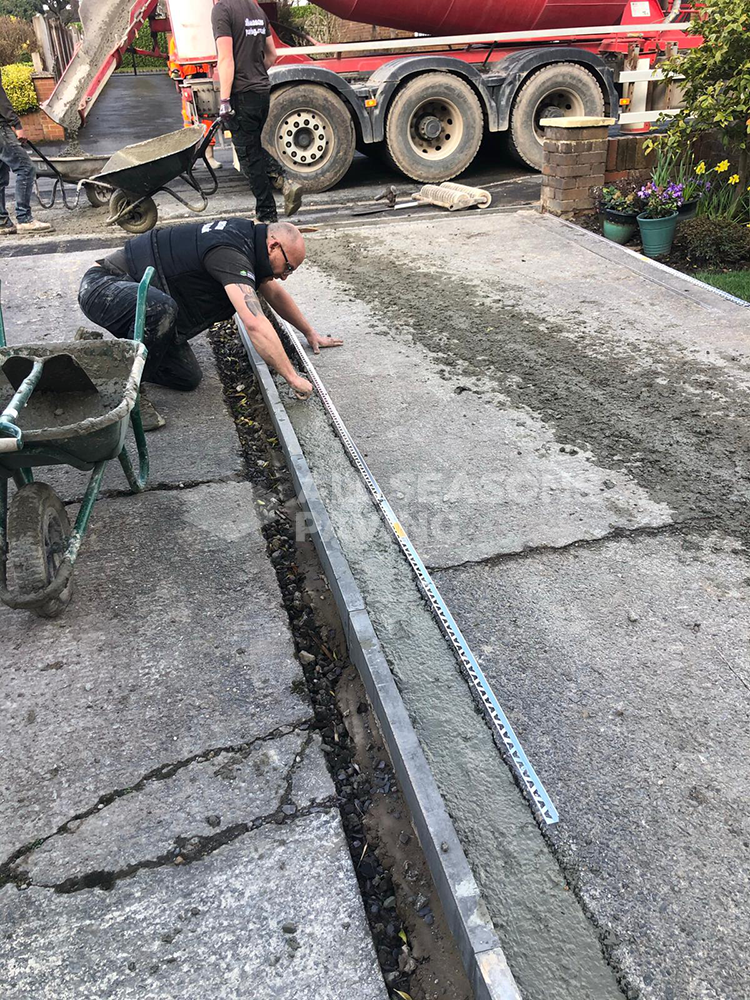 working on slate grey resin driveway